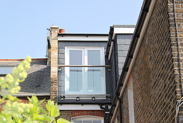 Mansard dormer loft conversion with juliette balcony