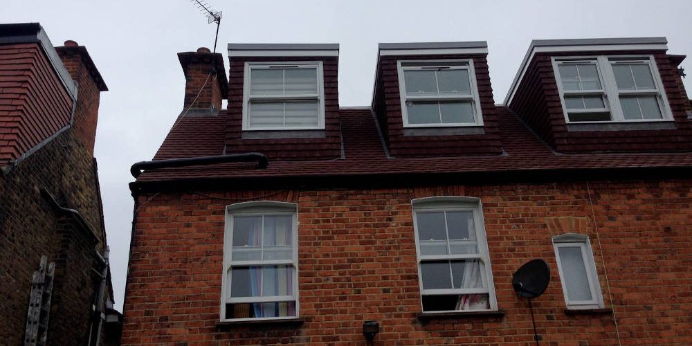 Three flat roof dormers in a house in Balham