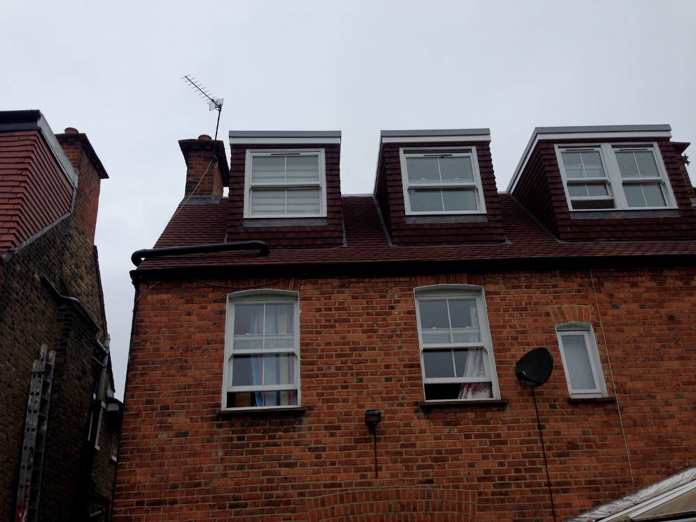 Three flat roof dormers in a house in Balham