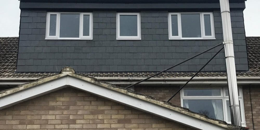 Touchstone lofts slate flat roof dormer loft conversion in a house in raynes park sw20