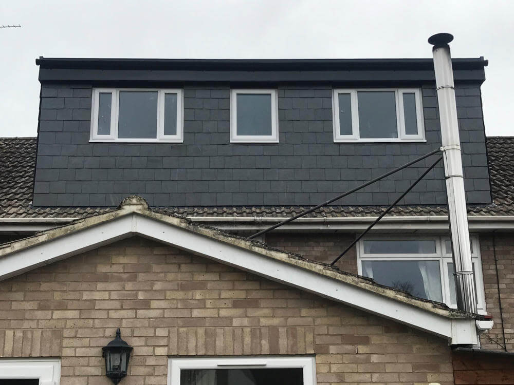 Touchstone lofts slate flat roof dormer loft conversion in a house in raynes park sw20